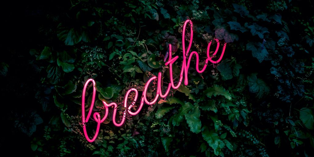 pink breathe neon sign