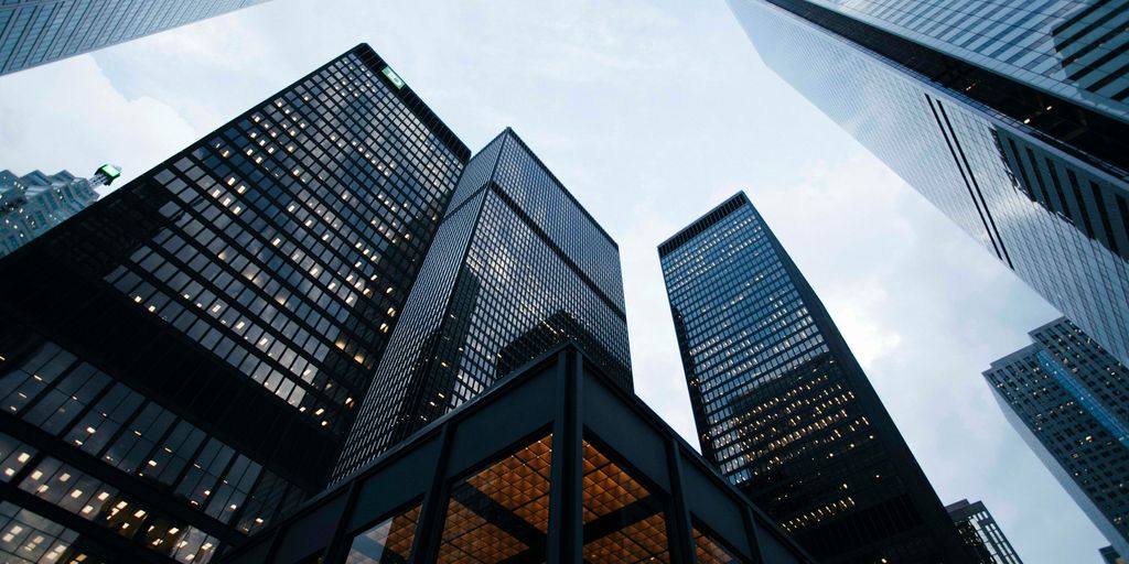 low angle photo of city high rise buildings during daytime